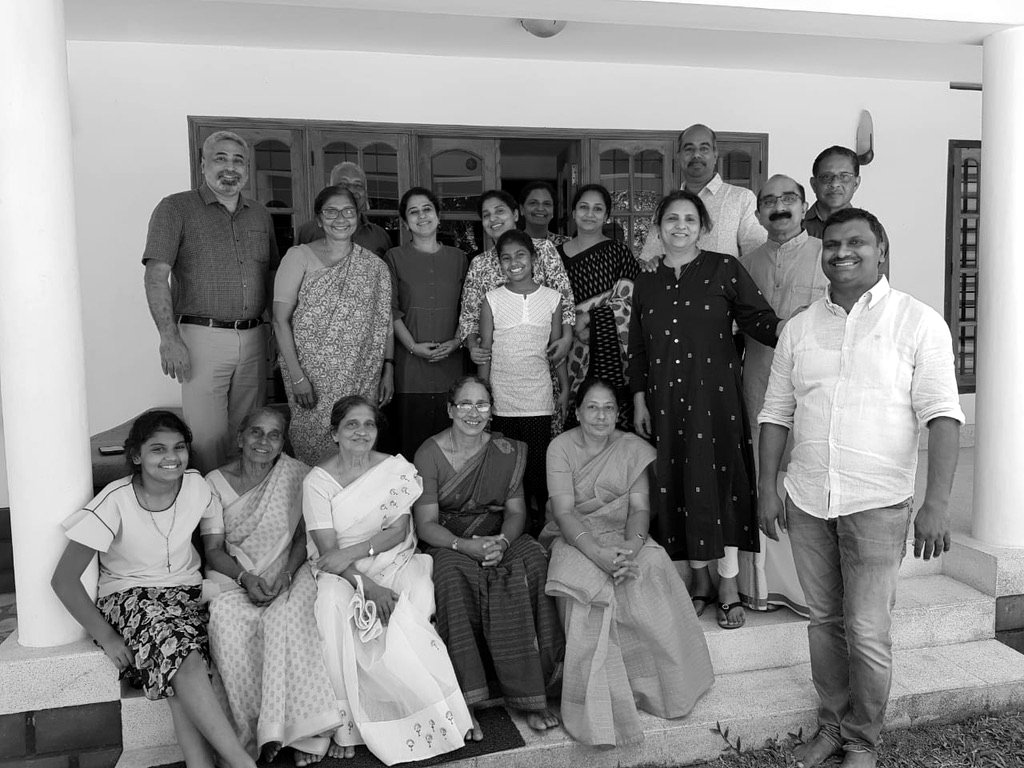 The extended family on the verandah steps