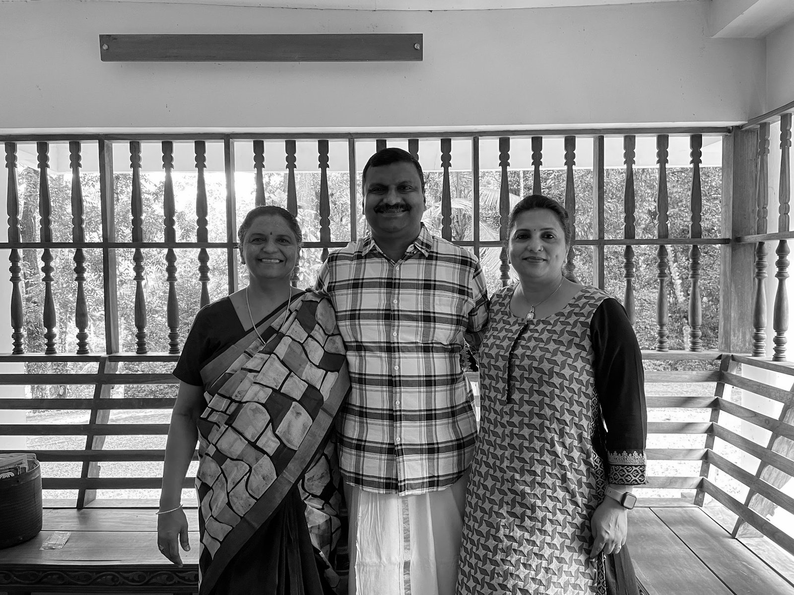 Reena, Kurian and Beena on the verandah